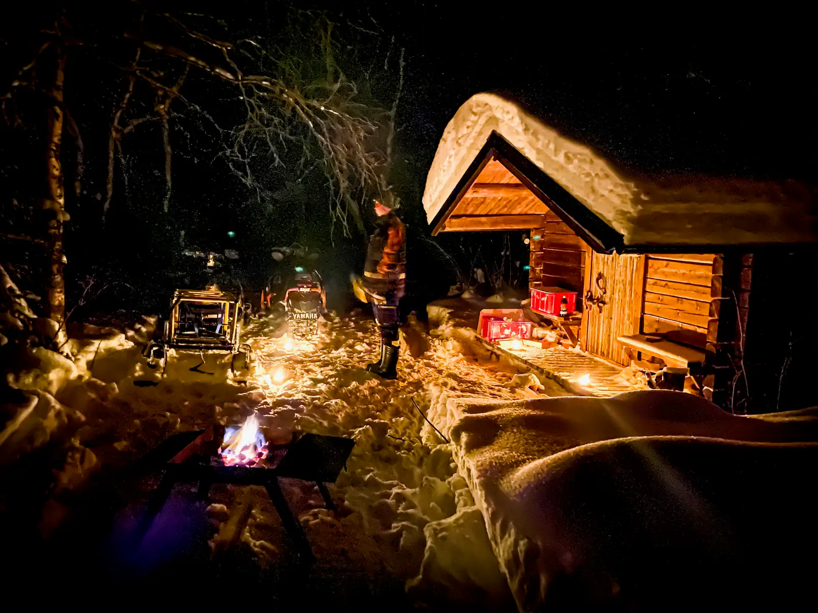 Firelit cabin in the snowy forest