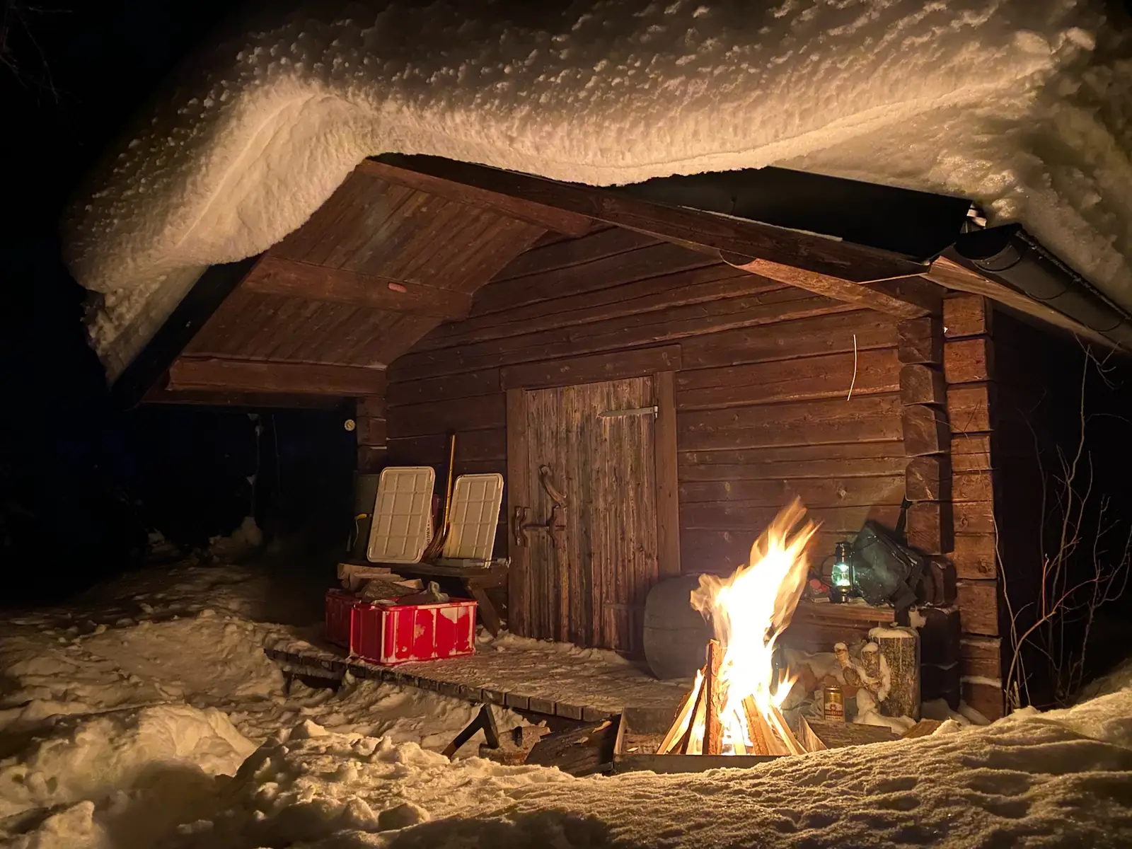 Campfire outside the timber hut